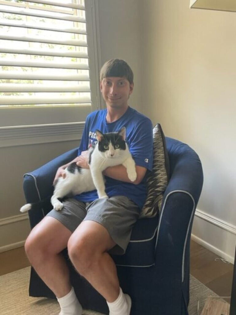 Philip Blout holding a cat